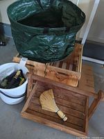 All main items together: garden bag, wooden trog with whisk broom, bucket with nozzles