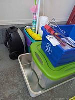 Group view showing vacuum, storage bins, roasting pan, cleaning tools