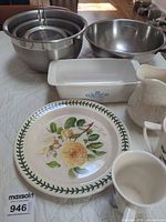 Overall lot with bowls, strainer, CorningWare dish, Portmeirion plate, pitcher, mugs