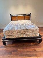Full view of assembled queen bed set with mattress on platform frame