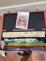 Open case showing tiles, racks, booklet