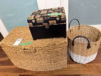 Group shot of seagrass trunk, white-dipped basket, and upholstered ottoman