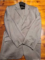 Front view of gray herringbone suit jacket