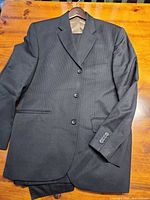 Front view of charcoal pinstripe jacket