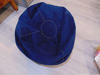 Top view of blue microsuede bean bag showing overall shape and stitching
