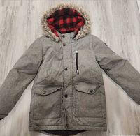 Full view of gray parka front with hood and pockets