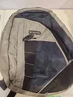 Front view of Columbia olive/black cooler backpack