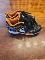Side view of both cleats showing color scheme and condition