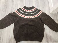 Full view of front/back of sweater showing color, pattern and size