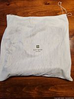 White Kate Spade New York dust cover