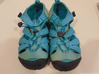 Top view of both sandals showing color, style, closed toe, lacing and straps