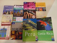 All eight books laid out on table