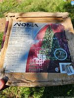 Front of product box showing NOMA branding, 7 ft height and 300 lights