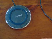 Top view of Samsung charging pad with attached cable
