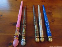 All five wands laid out showing colors and designs