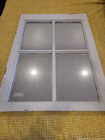 Front view of white-painted six-pane window sash mirror