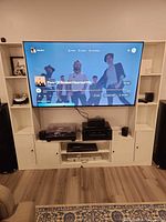 Front view showing entire entertainment center with towers and center console