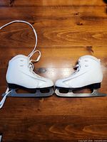 side view of both skates showing uppers and blades