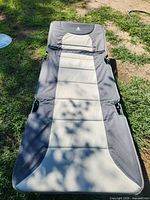 Cot fully deployed on grass showing full sleeping surface