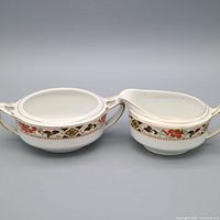 open sugar bowl and creamer front view