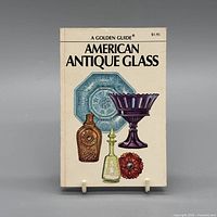 Front cover showing title, author, series, price, and illustrated glass items