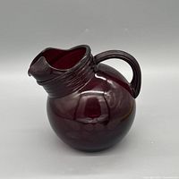 Side view showing deep cranberry color, applied handle and ice lip spout