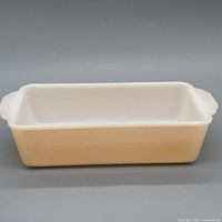 Top view of peach and white milk glass loaf pan