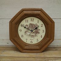 Front view of Brewster octagon wood wall clock showing dial and hands