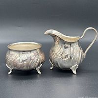 Creamer and sugar bowl side-by-side showing overall form