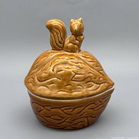 Front view of ceramic jar with squirrel on lid