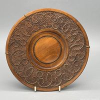 Front view showing embossed scroll design and overall condition