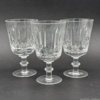 All three matching cut crystal goblets side by side