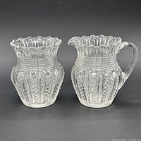 Front view of creamer and sugar bowl showing overall form and matching pattern