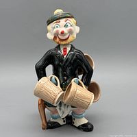 front view of clown decanter with four mugs attached