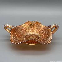 Angled view showing overall shape, handles, floral medallion pattern