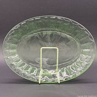 Front view of green oval platter on stand