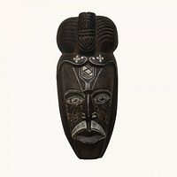 Full view of carved wooden mask showing overall design and size
