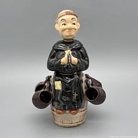 Front view monk decanter with two mugs