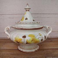 Front view of soup tureen with lid showing floral decoration