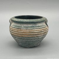 Front view showing color, ribbed body, lug handle detail