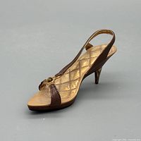 Side view of miniature slingback sandal figurine