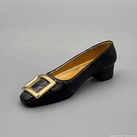 Left side view showing black resin pump and gold buckle