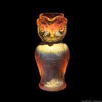 Front view of owl creamer showing iridescent finish and overall form