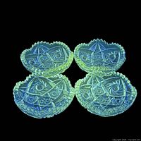 Four bowls glowing under blacklight