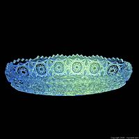 Serving dish under 365 nm blacklight showing green fluorescence