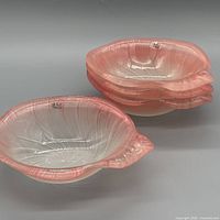 Stacked view showing four Mikasa pink and white seashell bowls