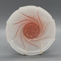 top view showing pink and white swirl and ruffled edge