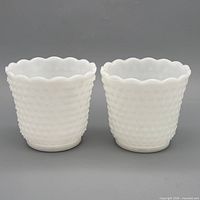 Pair of white milk glass hobnail planters front view