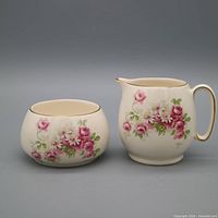 Creamer and sugar bowl front view showing floral pattern