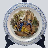 Full view of porcelain plate showing scene and border